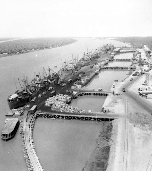 Ships unloading at the Abadan waterfront in 1942. The rail lines and some wagons are in evidence. [30]